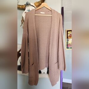 Pink knitted cardigan with pockets
